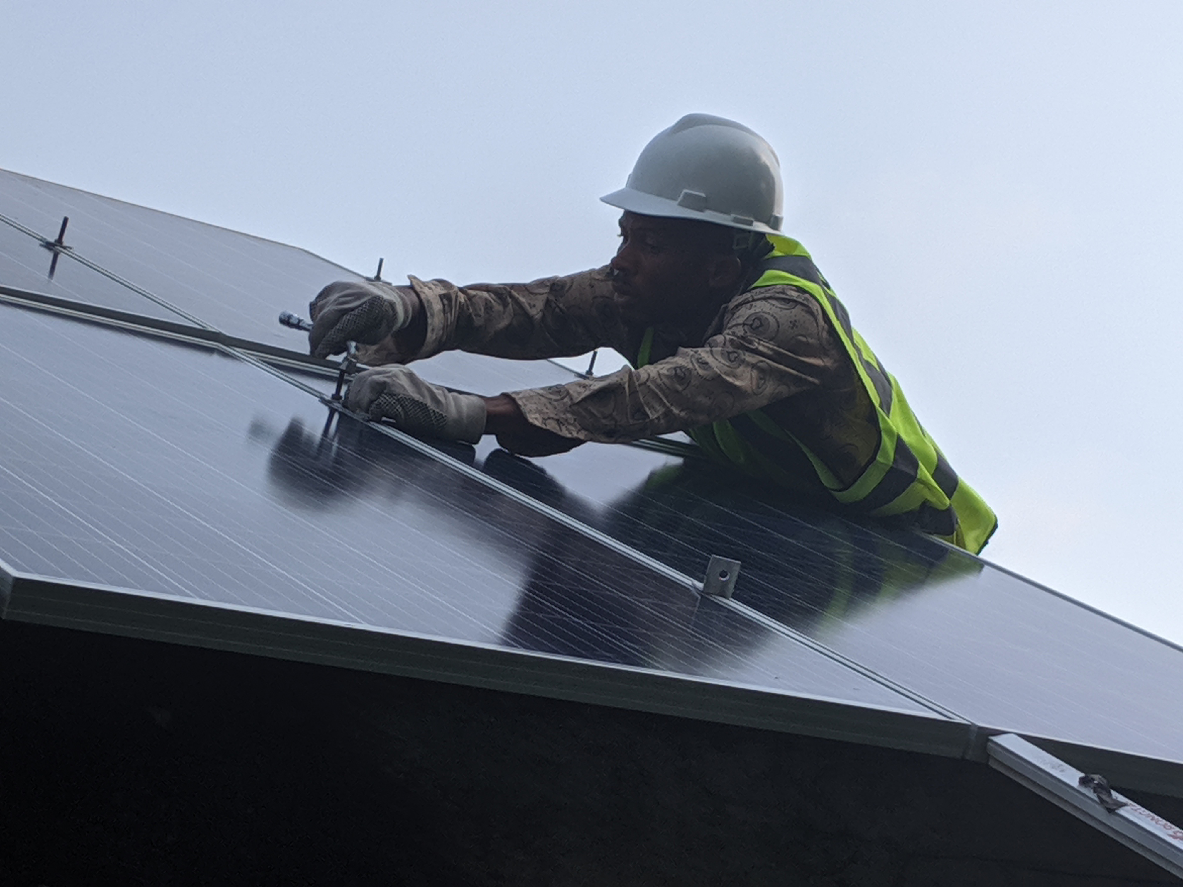 Vectis engineer fixing a solar panel