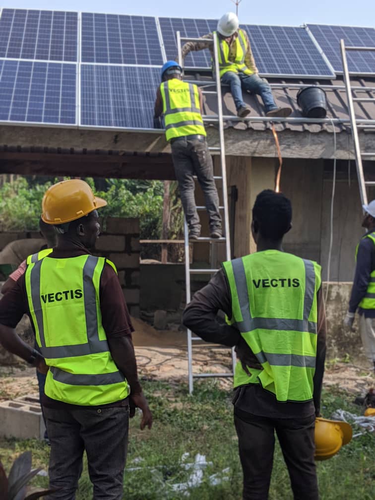 Vectis crew installing a rooftop solar array